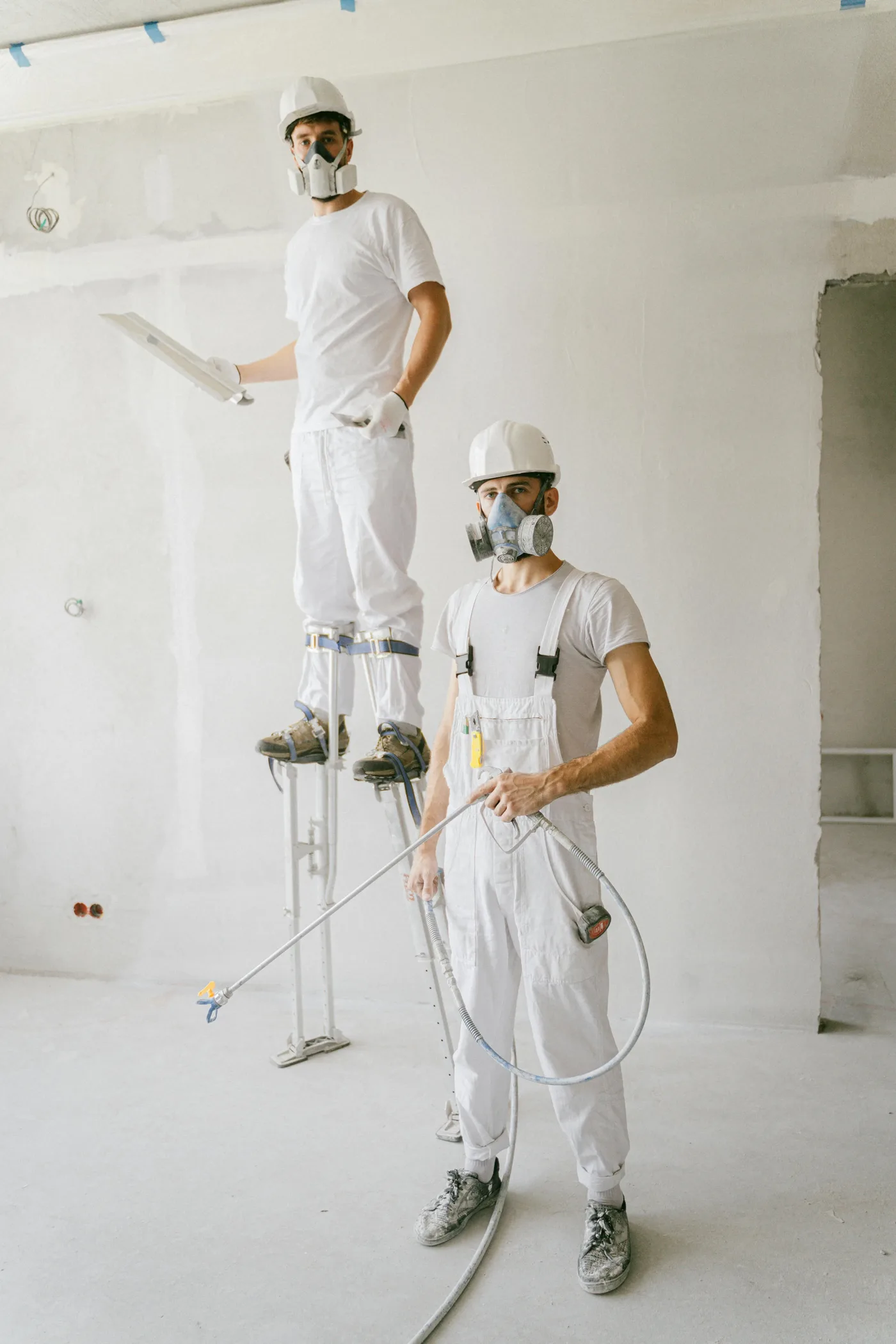 water damage restoration Nashville Tennessee — technician extracting water from flooded living room